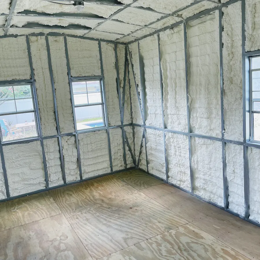 Closed-cell spray foam insulation applied to wall cavities in a residential project in North Syracuse